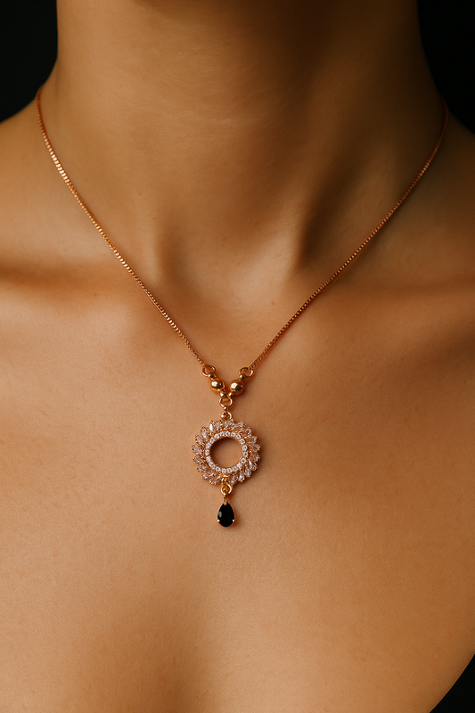 Elegant Rose Gold Stainless Steel Sunburst Necklace with Black Teardrop Charm